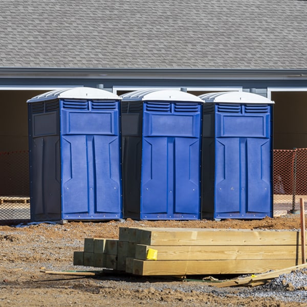 how often are the portable restrooms cleaned and serviced during a rental period in Badger